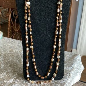 Unmarked double strand 16”+ 2” ext. shades of brown beads w/mop chunks $39